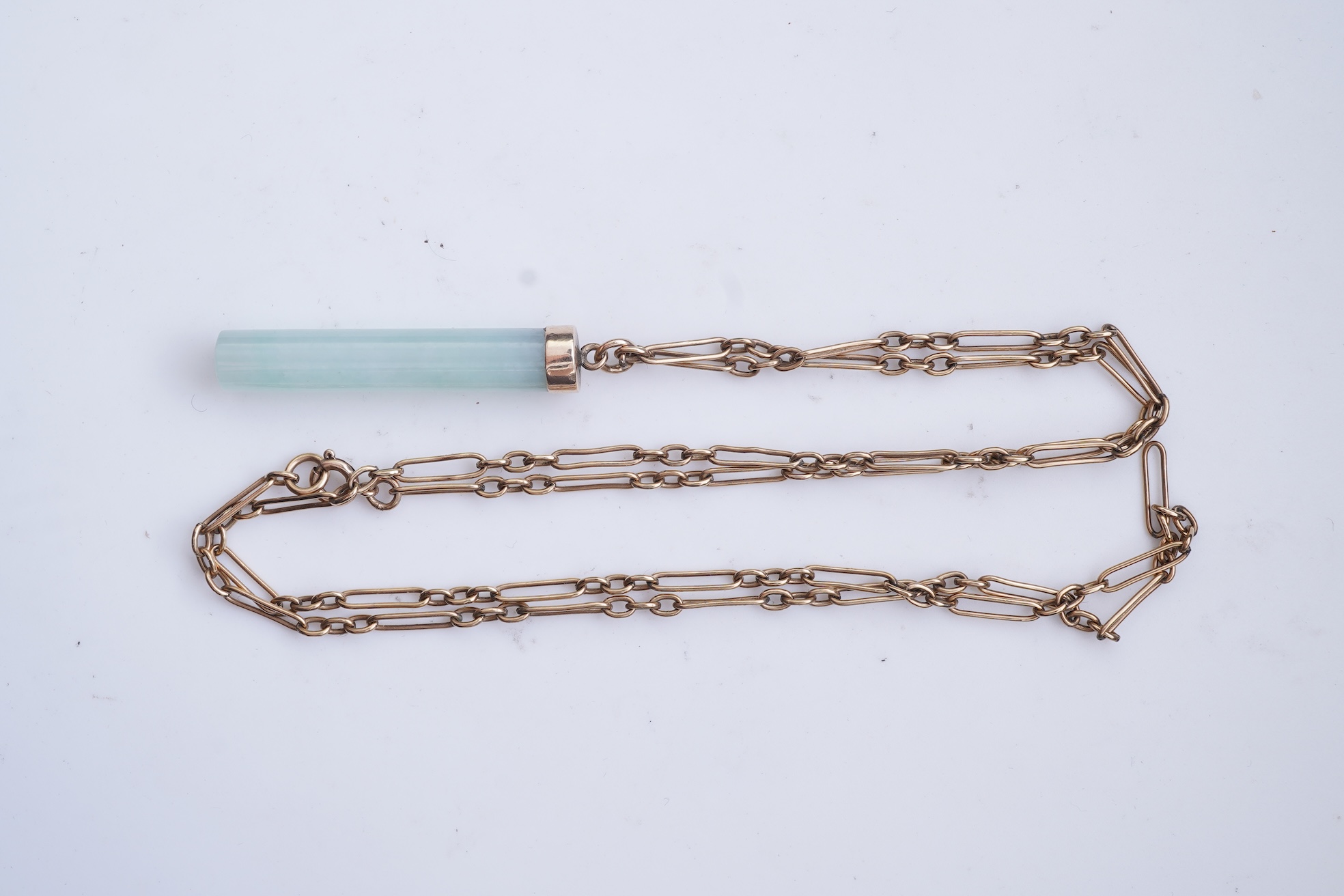 A jadeite pendant and pair of earrings